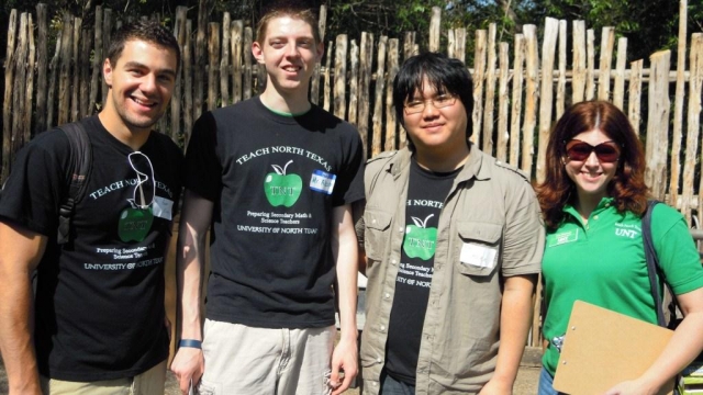 Students posing in UNT T-shirts